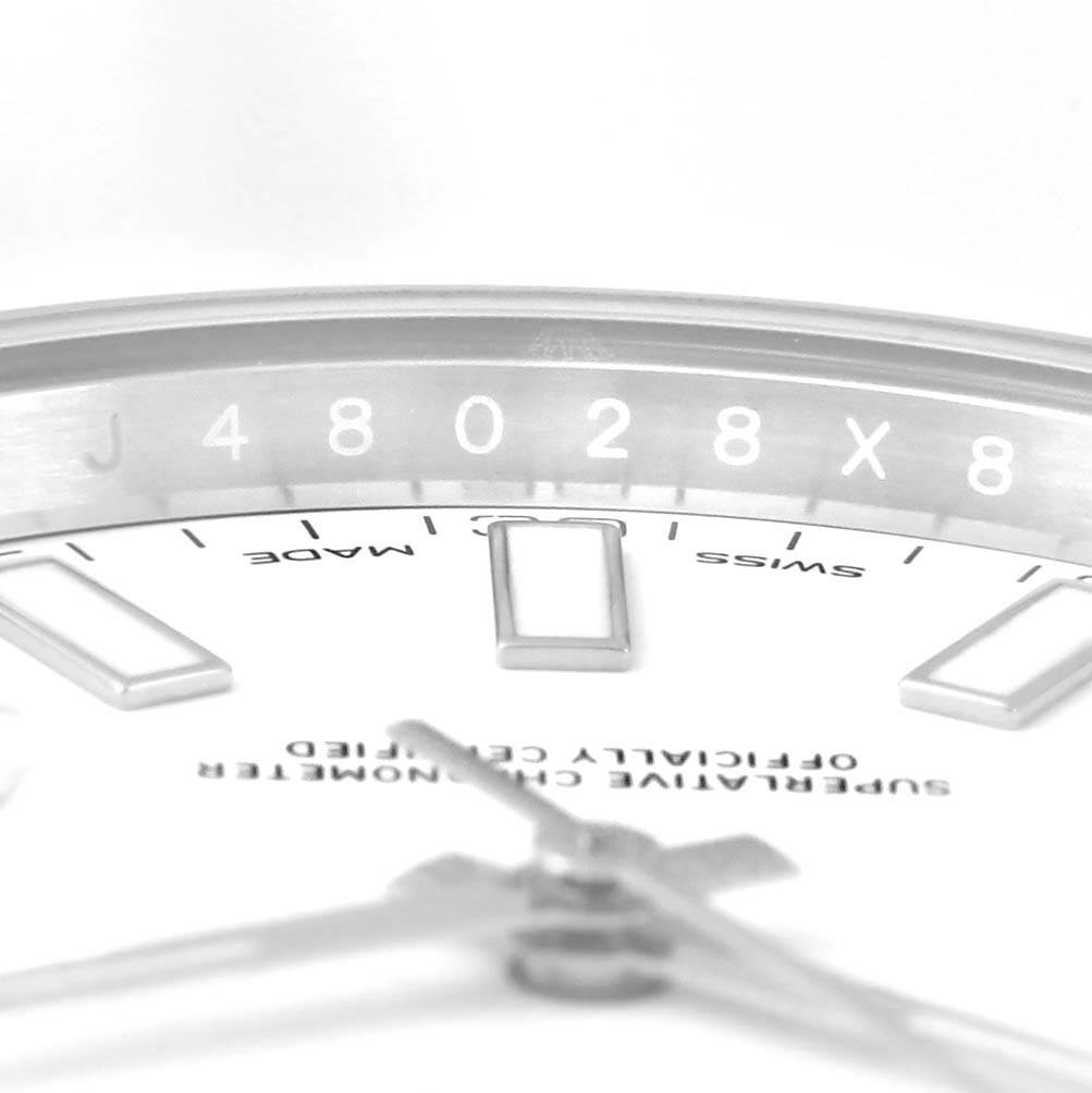 This image shows a close-up of the dial and part of the bezel of the Rolex Datejust 41 116300 Men's Stainless Steel White Dial 116300 Men's Stainless Steel White Dial watch.