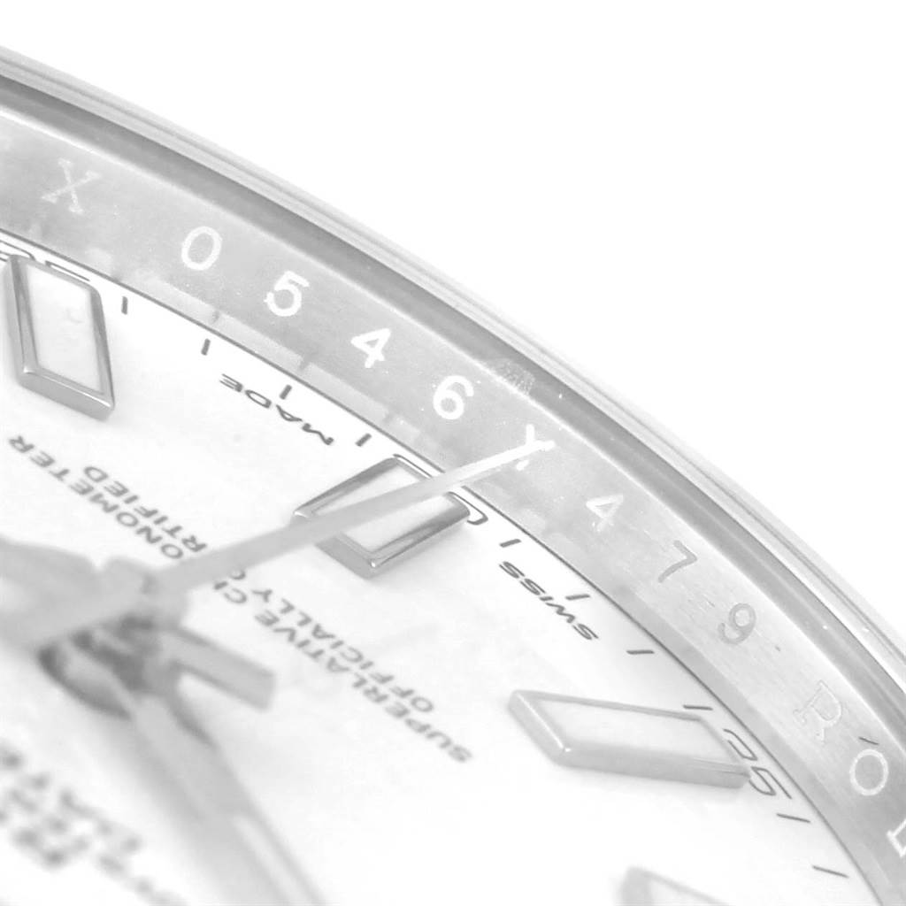 The photo shows a close-up of the dial and bezel of the Rolex Datejust 41 116300 Men's Stainless Steel White Dial 116300 Men's Stainless Steel White Dial, highlighting the hour markers and parts of the hands.