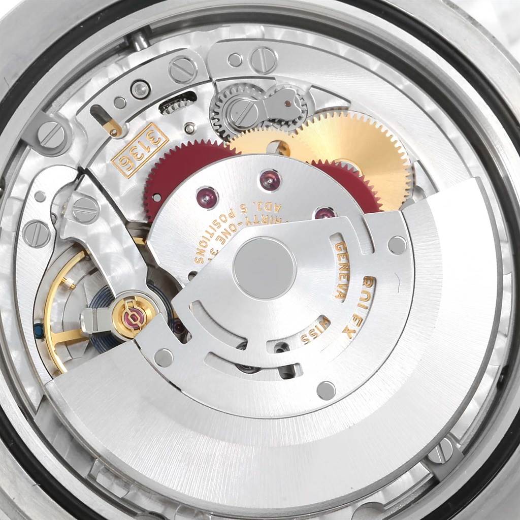 This is a close-up shot of the Rolex Datejust 41 116333 Men's Steel and Gold (two tone) Beige Dial 116333 Men's Steel and Gold (two tone) Beige Dial model's internal mechanism, showcasing gears and other components.