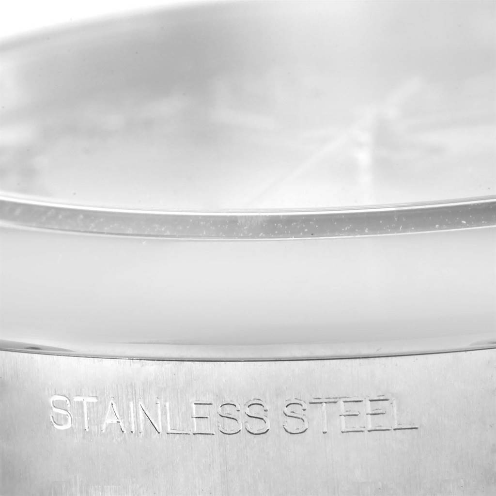 This image shows a close-up of the stainless steel case of the Rolex Datejust 41 116300 Men's Stainless Steel Silver Dial 116300 Men's Stainless Steel Silver Dial model.