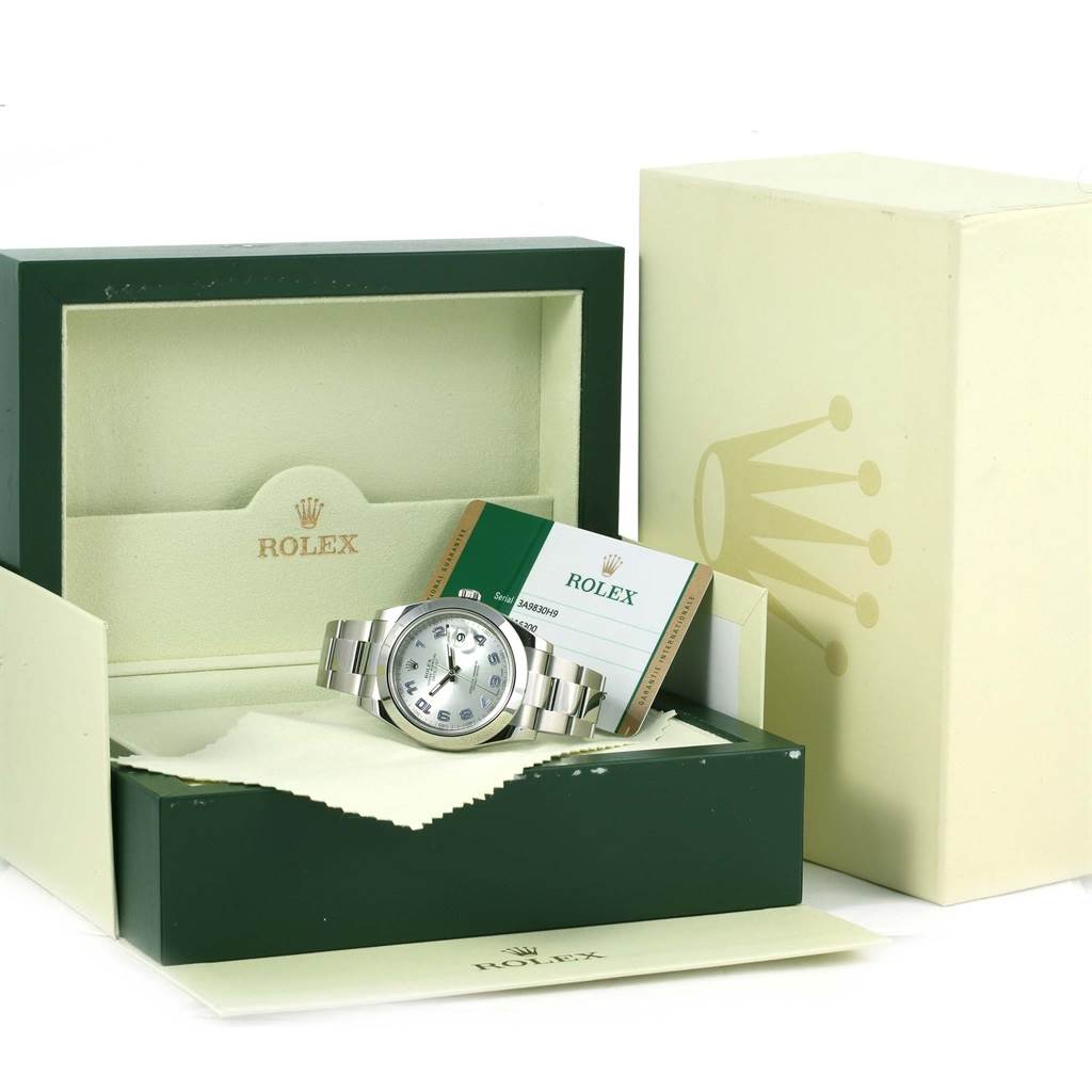 The Rolex Datejust 41 116300 Men's Stainless Steel Silver Dial 116300 Men's Stainless Steel Silver Dial watch is displayed in its open box with accompanying warranty card and cloth.