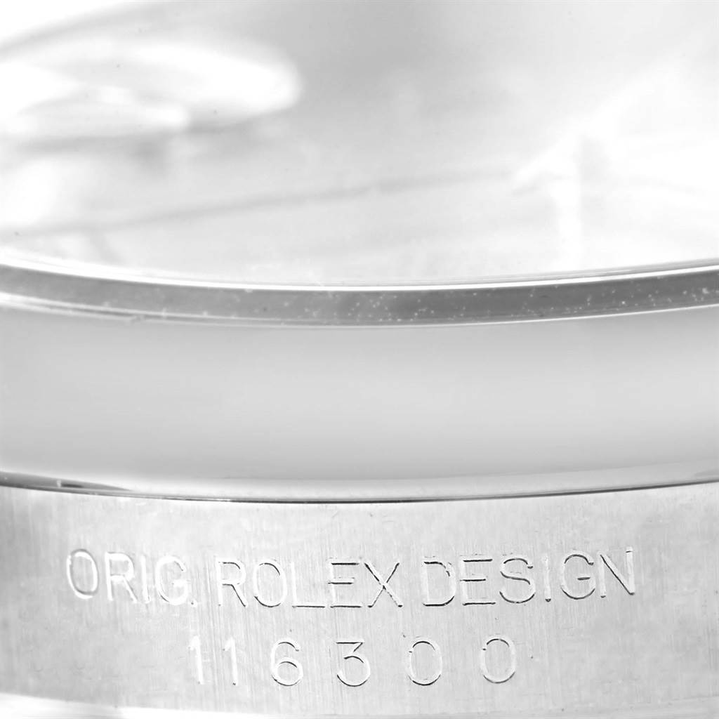 This image shows the side of a Rolex Datejust 41 116300 Men's Stainless Steel Silver Dial 116300 Men's Stainless Steel Silver Dial, focusing on the engraved case details.