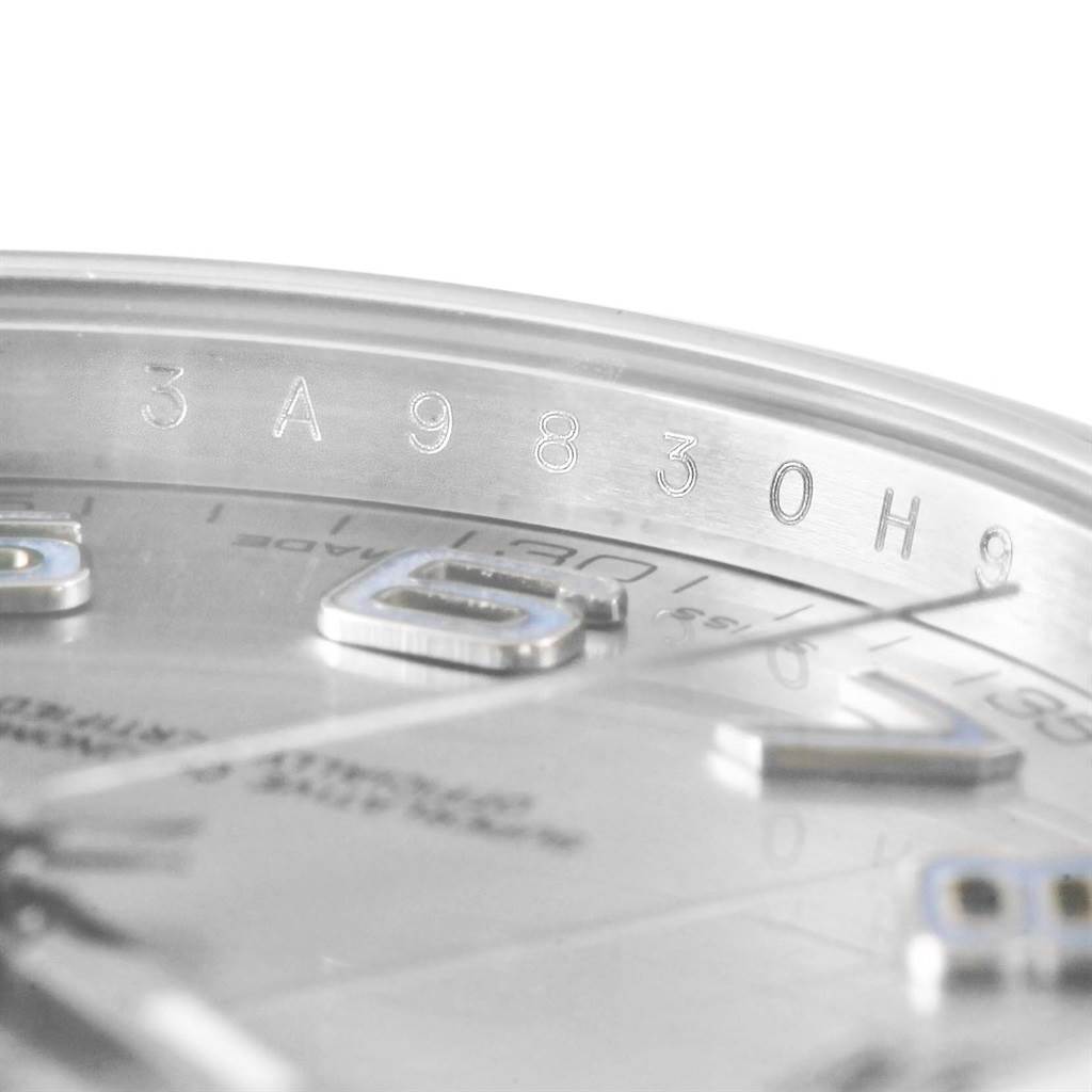 The image shows a close-up of the serial number engraving along the inner bezel of the Rolex Datejust 41 116300 Men's Stainless Steel Silver Dial 116300 Men's Stainless Steel Silver Dial watch.