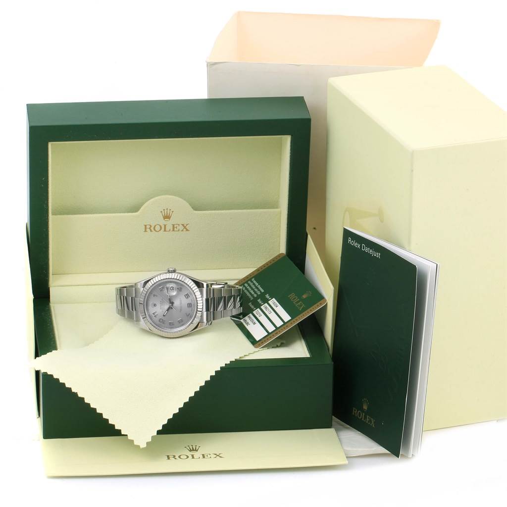 The Rolex Datejust 41 116334 Men's Stainless Steel Grey Dial 116334 Men's Stainless Steel Grey Dial watch, shown front-facing, is displayed in its branded box with an instruction manual and tags.