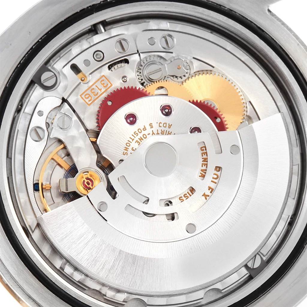 The image shows the intricate internal mechanism of a Rolex Datejust 41 116333 Men's Steel and Gold (two tone) Champagne Dial 116333 Men's Steel and Gold (two tone) Champagne Dial watch from a top-down angle.