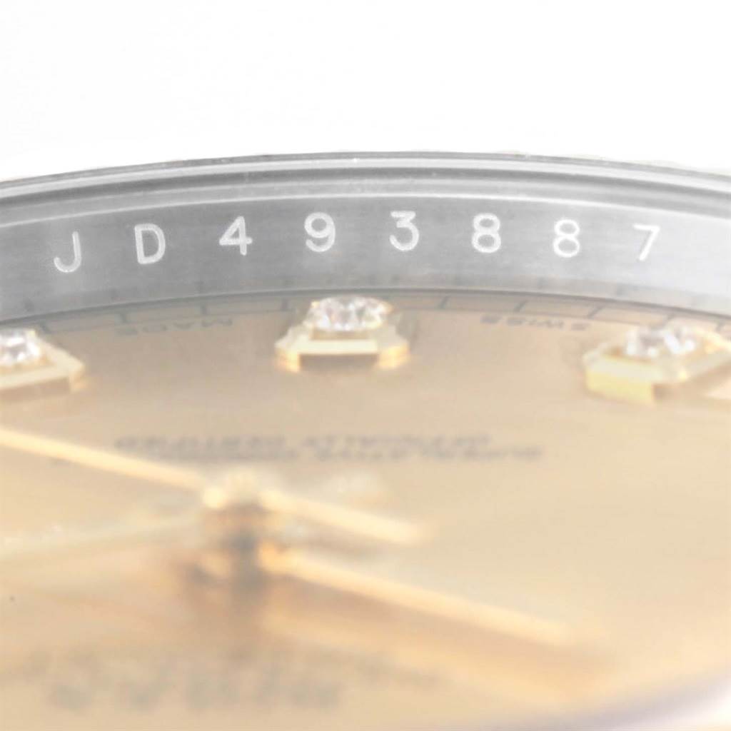 The image shows a close-up top view of the Rolex Datejust 41 116333 Men's Steel and Gold (two tone) Champagne Dial 116333 Men's Steel and Gold (two tone) Champagne Dial watch, focusing on the serial number and part of the dial.