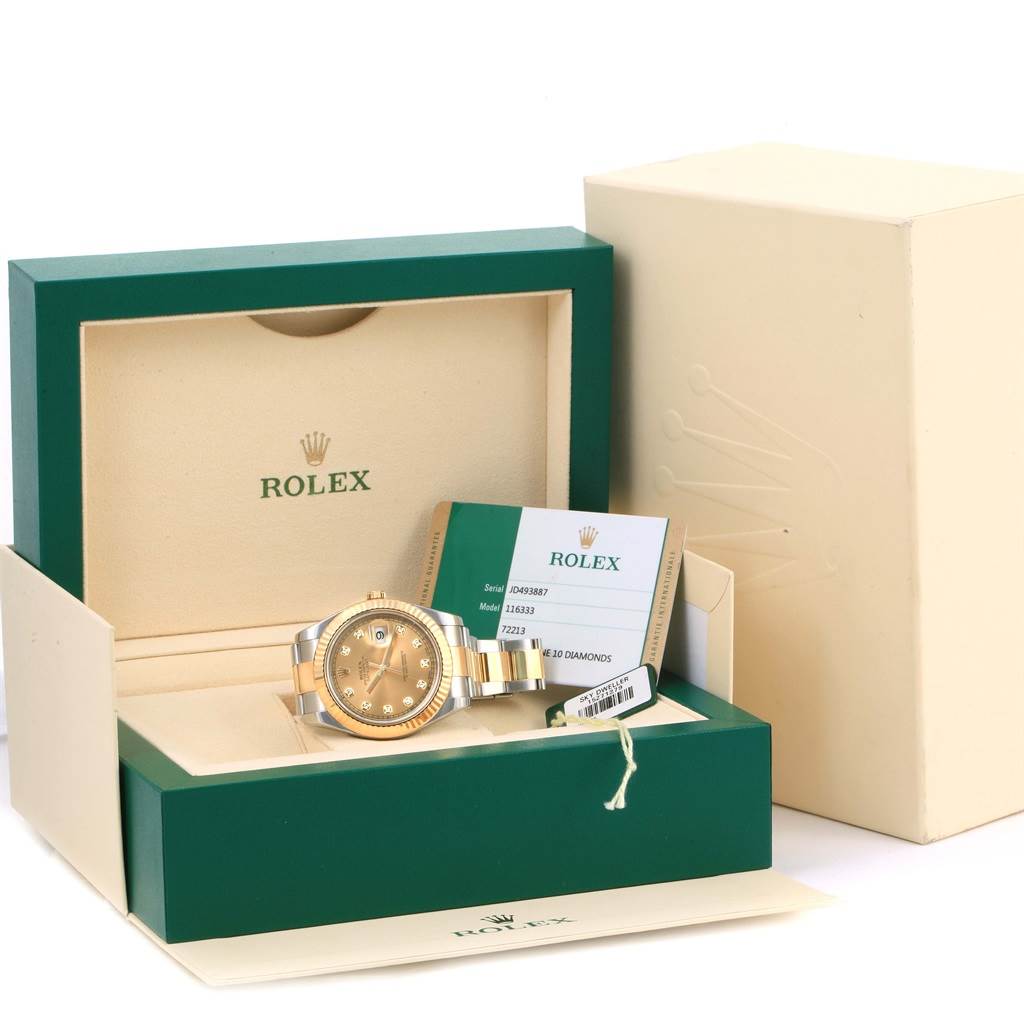 The Rolex Datejust 41 116333 Men's Steel and Gold (two tone) Champagne Dial 116333 Men's Steel and Gold (two tone) Champagne Dial watch and its documentation are displayed in an open box, showcasing the dial and part of the bracelet.