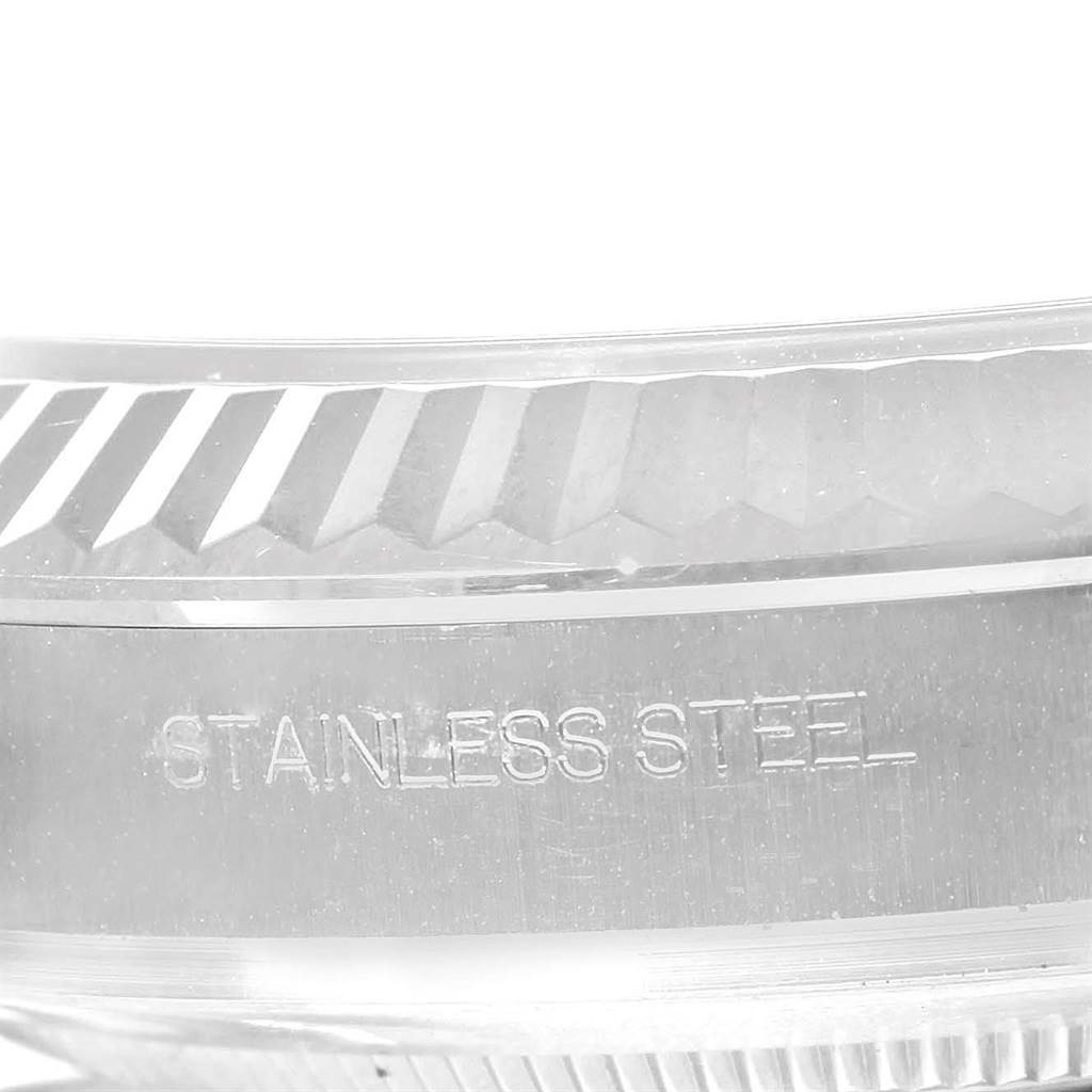 The image shows a close-up of the stainless steel casing and fluted bezel of the Rolex Datejust 41 116334 Men's Stainless Steel Blue Dial 116334 Men's Stainless Steel Blue Dial watch.