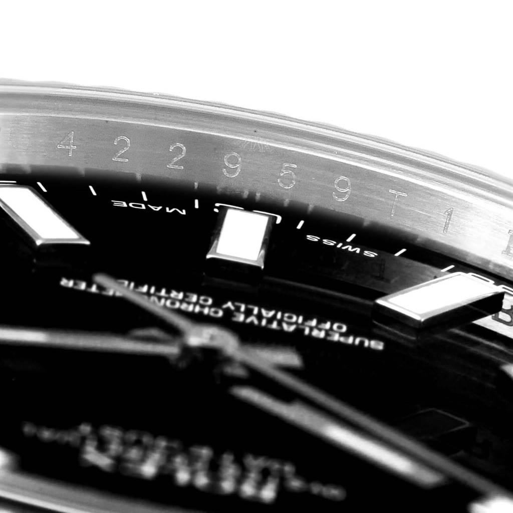 This close-up angle of the Rolex Datejust 41 116334 Men's Stainless Steel Black Dial 116334 Men's Stainless Steel Black Dial shows part of the dial, bezel, and serial number.