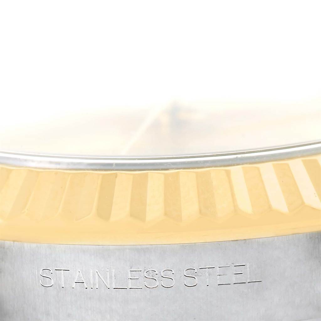 The image shows a close-up of the bezel and case edge of a Rolex Datejust 41 116333 Men's Steel and Gold (two tone) Champagne Dial 116333 Men's Steel and Gold (two tone) Champagne Dial, highlighting the fluted bezel and "STAINLESS STEEL" engraving.