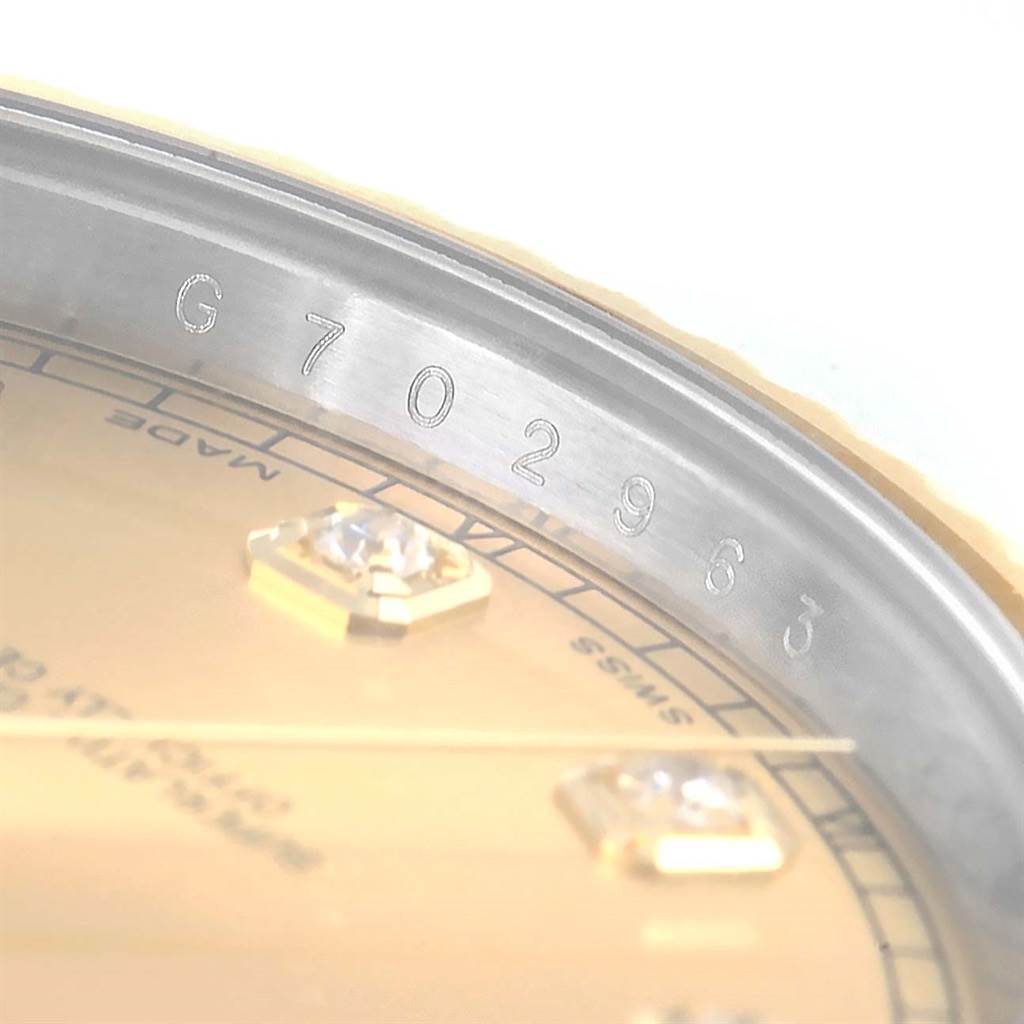 The image shows a close-up of the serial number engraving on the inner rim of the Rolex Datejust 41 116333 Men's Steel and Gold (two tone) Champagne Dial 116333 Men's Steel and Gold (two tone) Champagne Dial watch.