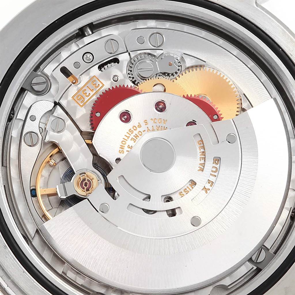 The image shows the intricate movement of a Rolex Datejust 41 116334 Men's Stainless Steel Silver Dial 116334 Men's Stainless Steel Silver Dial watch viewed from the back, revealing its gears and inner mechanisms.