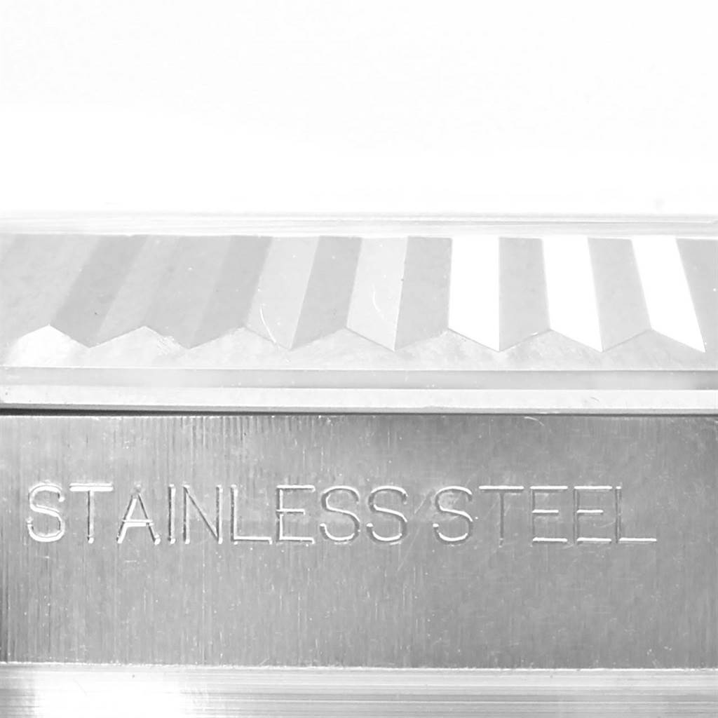 This image shows a close-up of the fluted bezel and "STAINLESS STEEL" engraving on the Rolex Datejust 41 116334 Men's Stainless Steel Silver Dial 116334 Men's Stainless Steel Silver Dial watch.