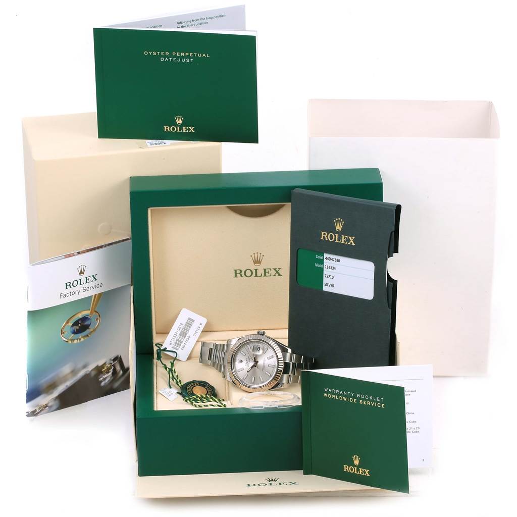 The image shows a Rolex Datejust 41 116334 Men's Stainless Steel Silver Dial 116334 Men's Stainless Steel Silver Dial watch in its box, with warranty booklets, tags, and accompanying documents displayed around.