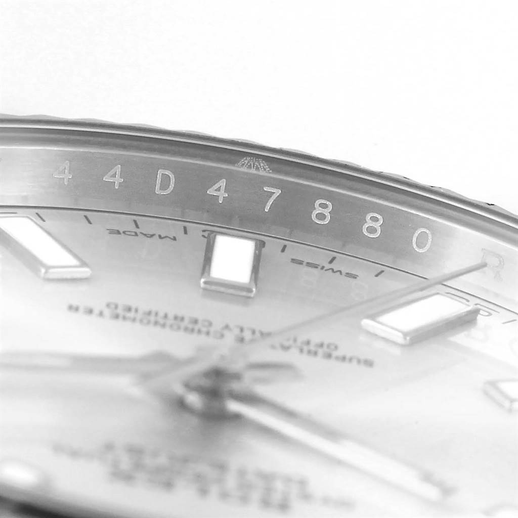 The image shows a close-up of the serial number and part of the dial of the Rolex Datejust 41 116334 Men's Stainless Steel Silver Dial 116334 Men's Stainless Steel Silver Dial watch.