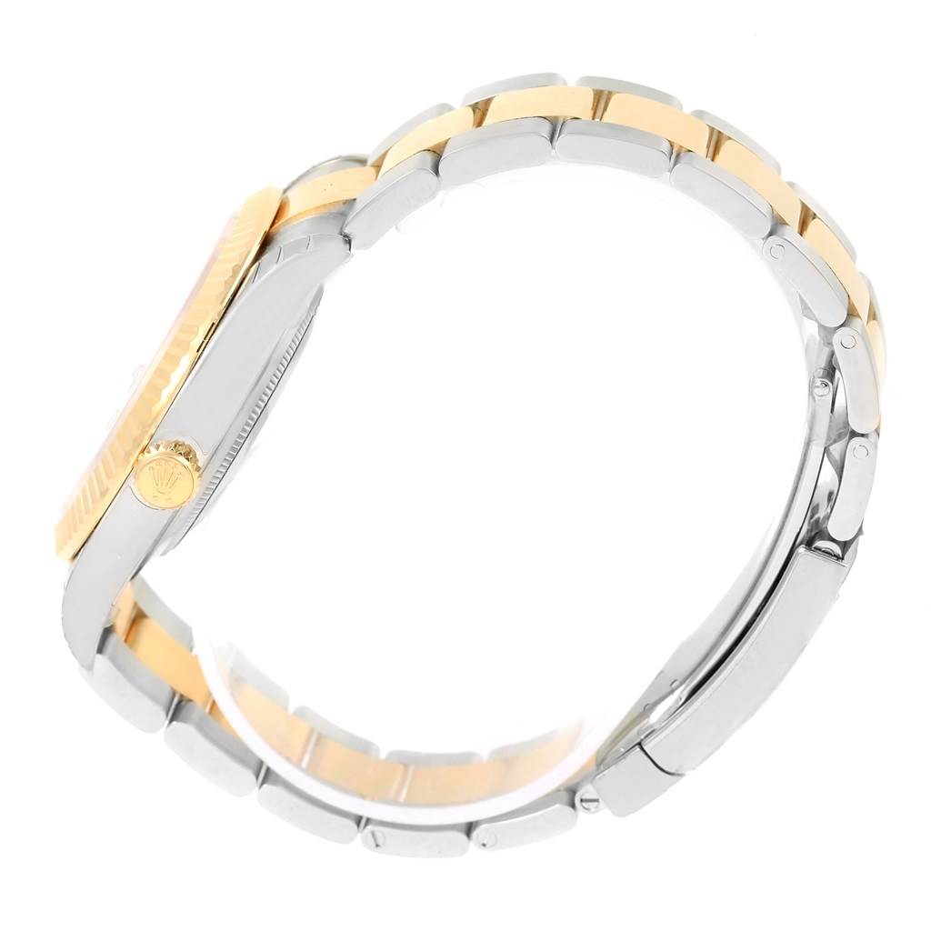 This side view of the Rolex Datejust 41 126333 Men's Steel and Gold (two tone) White Dial 126333 Men's Steel and Gold (two tone) White Dial showcases the two-tone bracelet, crown, and case.