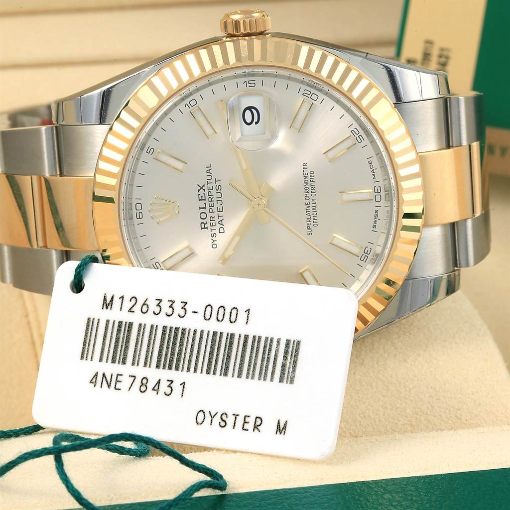 The Rolex Datejust 41 126333 Men's Steel and Gold (two tone) Silver Dial 126333 Men's Steel and Gold (two tone) Silver Dial watch is shown from a front angle, highlighting its dial, bezel, and part of the bracelet.