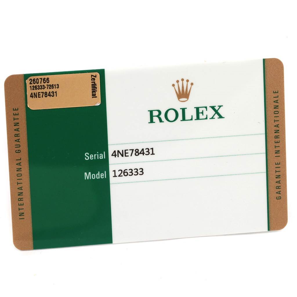 The image shows an international guarantee card for the Rolex Datejust 41 126333 Men's Steel and Gold (two tone) Silver Dial 126333 Men's Steel and Gold (two tone) Silver Dial model.
