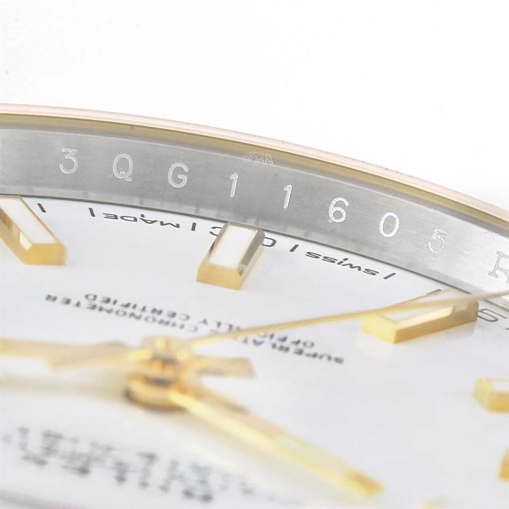 This close-up shows the Rolex Datejust 41 126333 Men's Steel and Gold (two tone) White Dial 126333 Men's Steel and Gold (two tone) White Dial dial with gold hour markers and sections of the rehaut engraving.