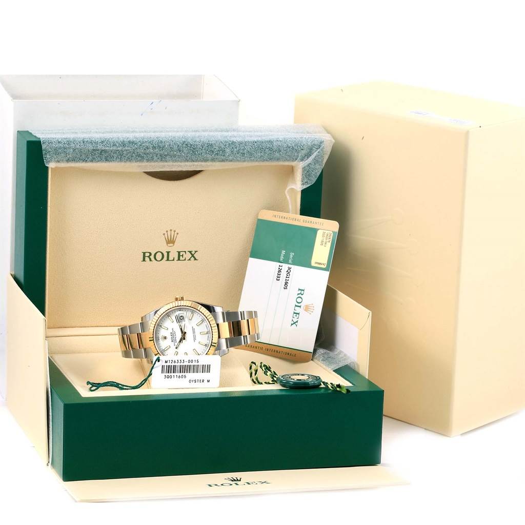 The image shows a Rolex Datejust 41 126333 Men's Steel and Gold (two tone) White Dial 126333 Men's Steel and Gold (two tone) White Dial watch angled from the front, inside an open green and beige box with its warranty card.
