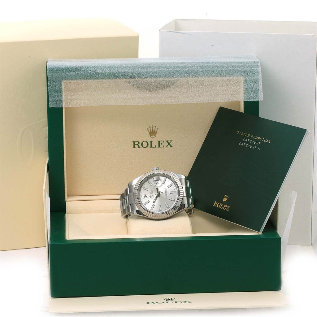The Rolex Datejust 41 116334 Men's Stainless Steel Silver Dial 116334 Men's Stainless Steel Silver Dial watch is displayed front and center in its open box, accompanied by a booklet.