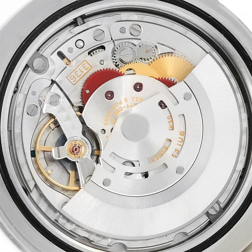 The image shows a close-up view of the movement inside a Rolex Datejust 41 116334 Men's Stainless Steel Silver Dial 116334 Men's Stainless Steel Silver Dial watch, highlighting gears and mechanisms.