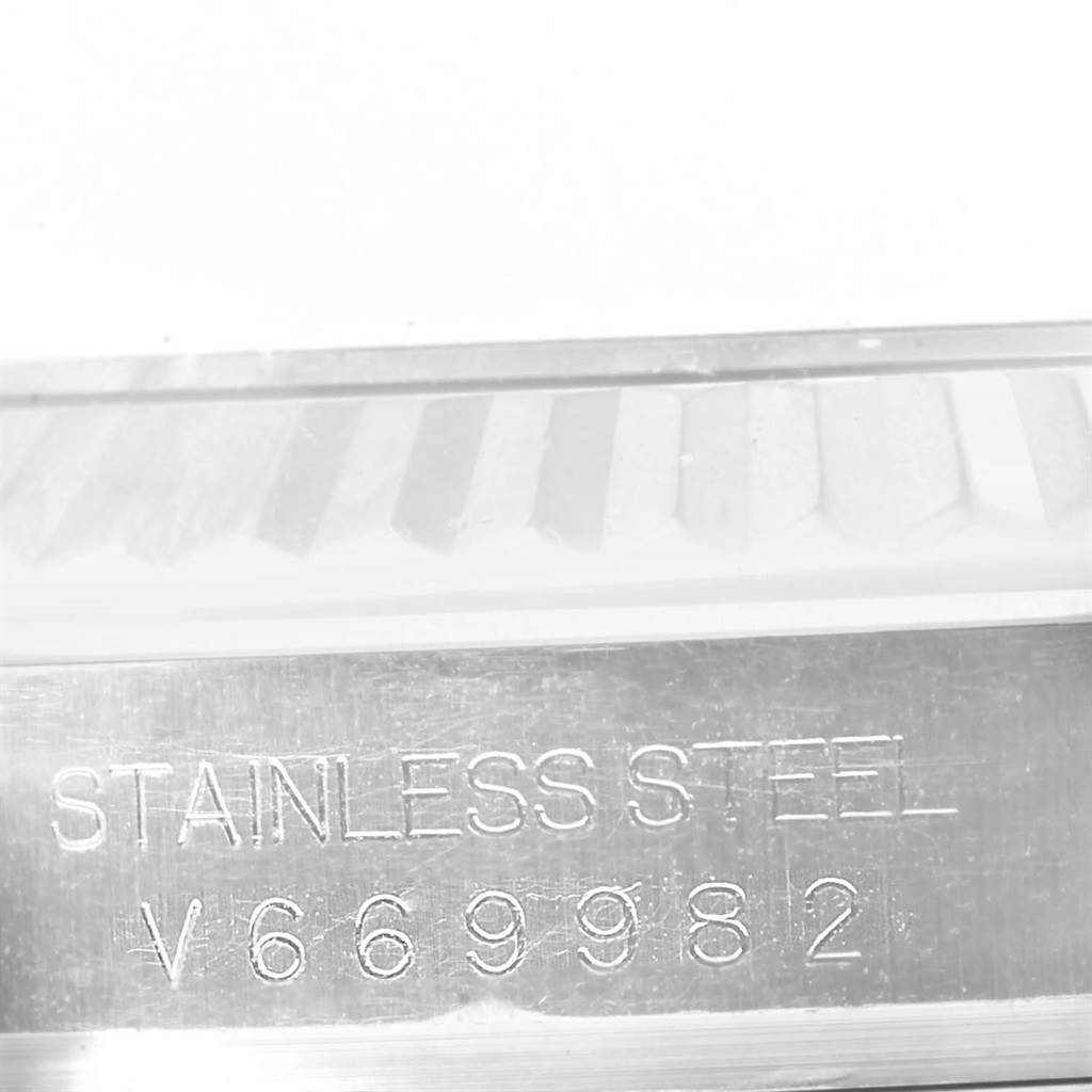 The image shows a close-up of the case side with "STAINLESS STEEL" and a serial number engraved on a Rolex Datejust 41 116334 Men's Stainless Steel Silver Dial 116334 Men's Stainless Steel Silver Dial.