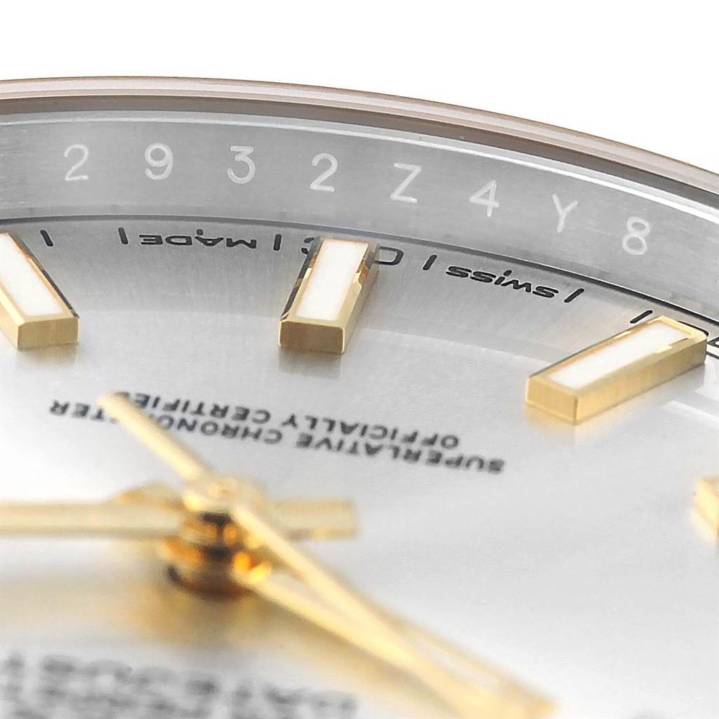 This close-up image of the Rolex Datejust 41 126333 Men's Steel and Gold (two tone) Silver Dial 126333 Men's Steel and Gold (two tone) Silver Dial watch shows part of the dial, hour markers, and a portion of the date indicator ring.