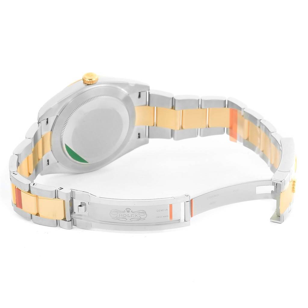 This image shows the back and bracelet of the Rolex Datejust 41 126333 Men's Steel and Gold (two tone) Silver Dial 126333 Men's Steel and Gold (two tone) Silver Dial watch at an angle, with the clasp open, revealing the Rolex logo inside.