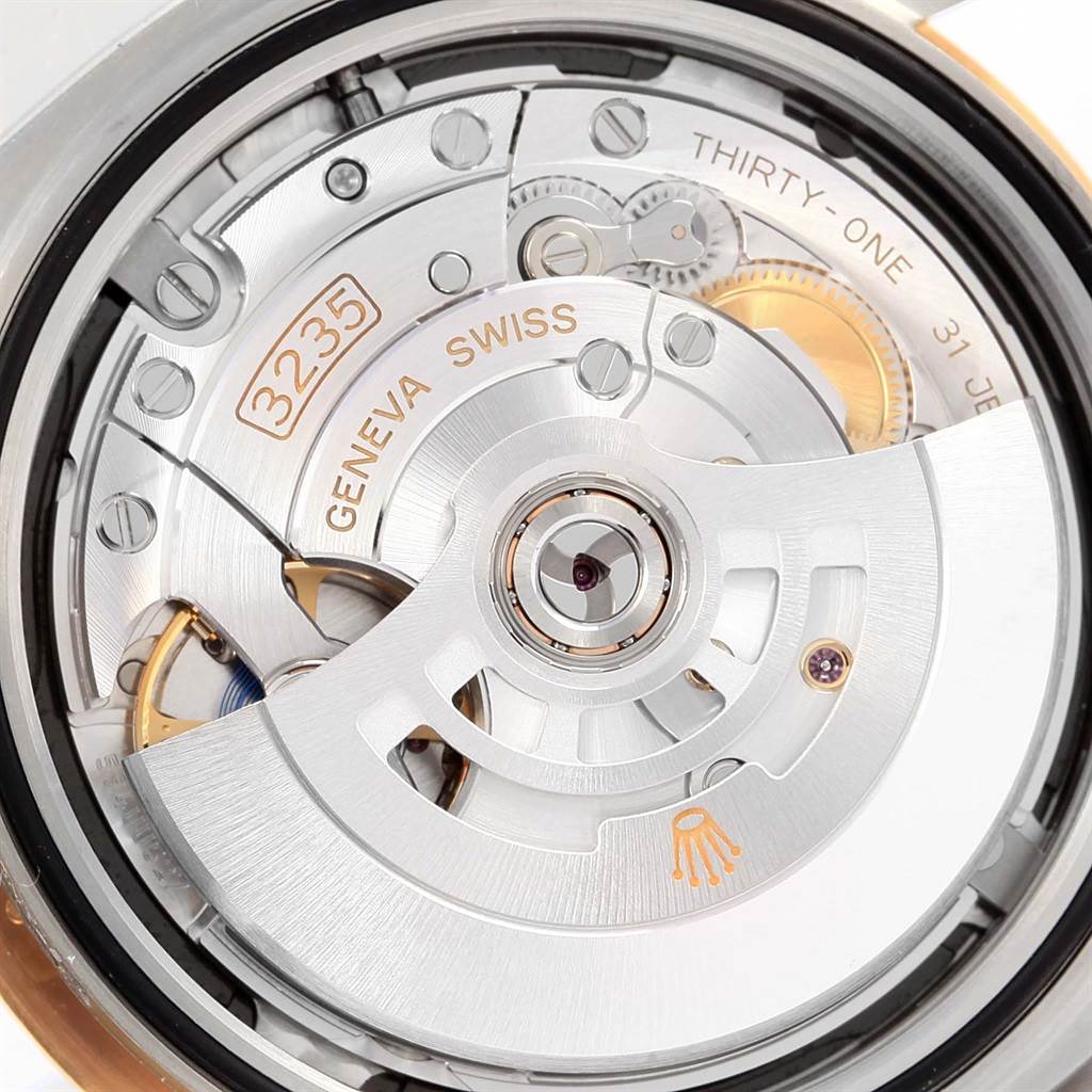 This image shows the automatic movement from the back of a Rolex Datejust 41 126333 Men's Steel and Gold (two tone) Black Dial 126333 Men's Steel and Gold (two tone) Black Dial watch, highlighting intricate gears and the rotor.