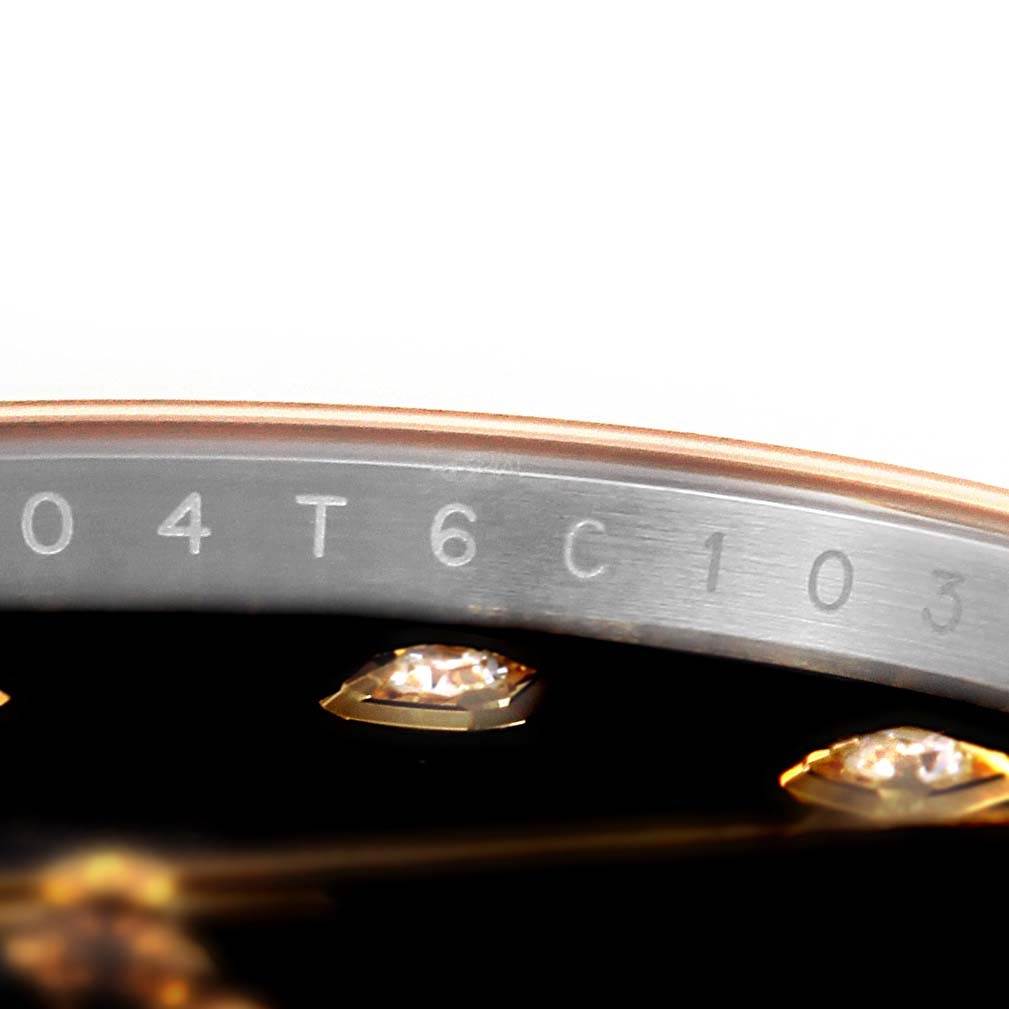 The image shows a close-up of the Rolex Datejust 41 126333 Men's Steel and Gold (two tone) Black Dial 126333 Men's Steel and Gold (two tone) Black Dial watch dial and part of the chapter ring with engraved markings.