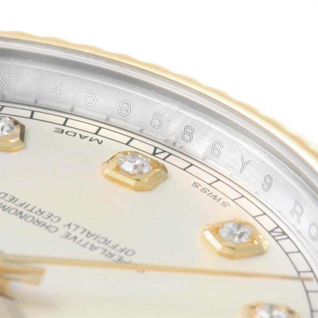 Close-up of a Rolex Datejust 41 116333 Men's Steel and Gold (two tone) Beige Dial 116333 Men's Steel and Gold (two tone) Beige Dial displaying part of the dial with diamond markers and inner bezel with serial numbers.
