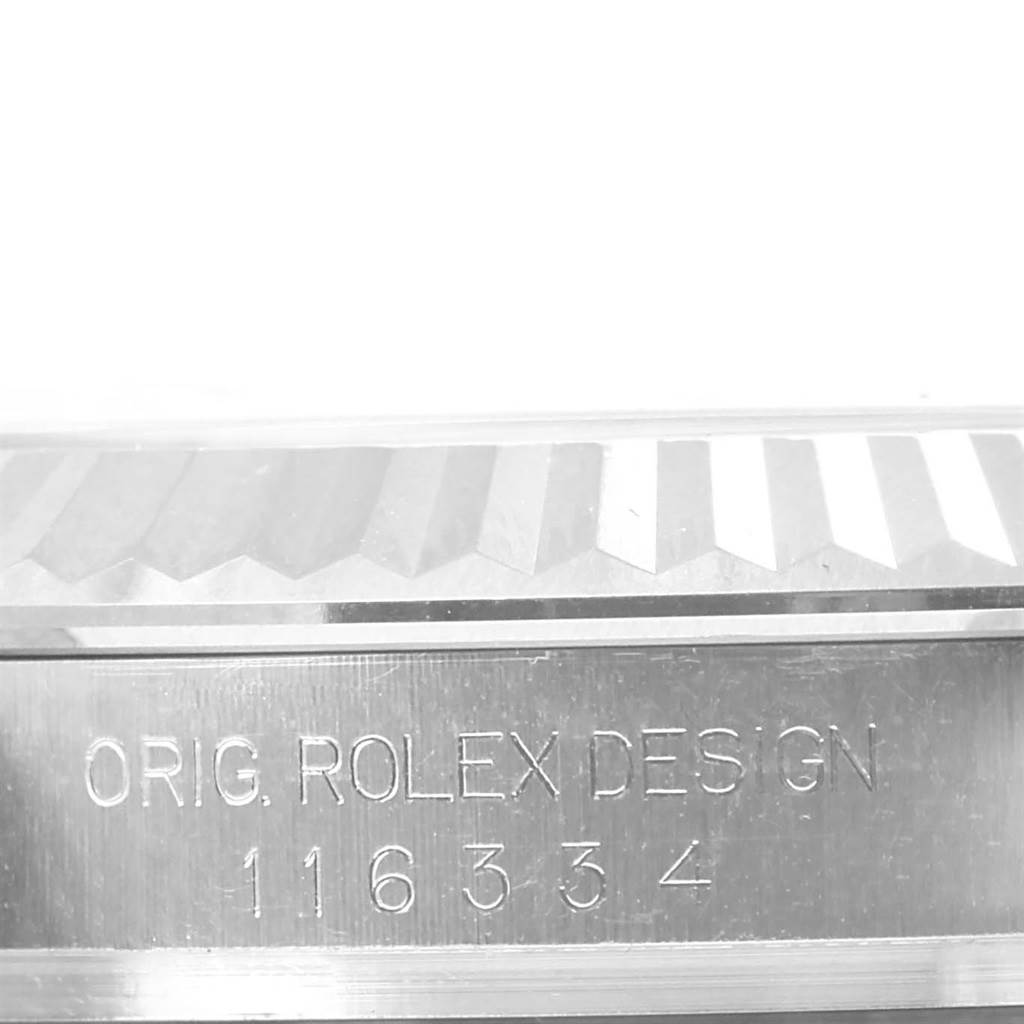 This image shows a close-up of the side of the bezel and case of a Rolex Datejust 41 116334 Men
s Stainless Steel Silver Dial 116334 Men
s Stainless Steel Silver Dial, displaying the model number and "Orig. Rolex Design" engraving.