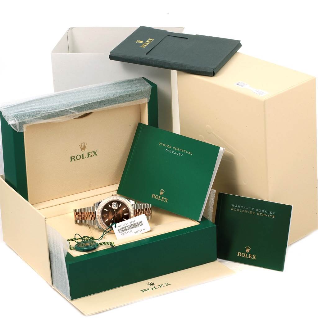 The image shows a Rolex Datejust 41 126331 Men's Steel and Gold (two tone) Brown Dial 126331 Men's Steel and Gold (two tone) Brown Dial watch, its original packaging, manuals, and warranty booklet, photographed from the front angle.