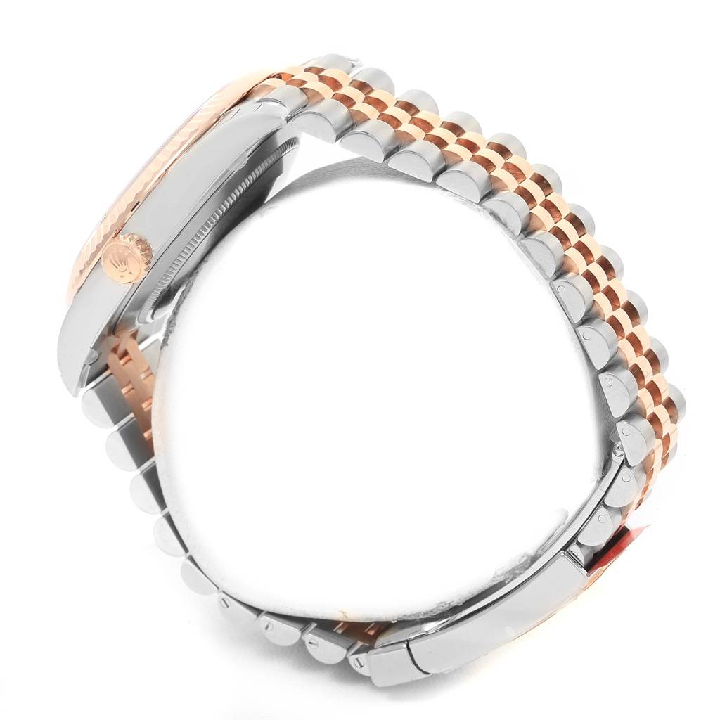 The image shows a side view of the Rolex Datejust 41 126331 Men's Steel and Gold (two tone) Brown Dial 126331 Men's Steel and Gold (two tone) Brown Dial watch, focusing on the crown and the bracelet.