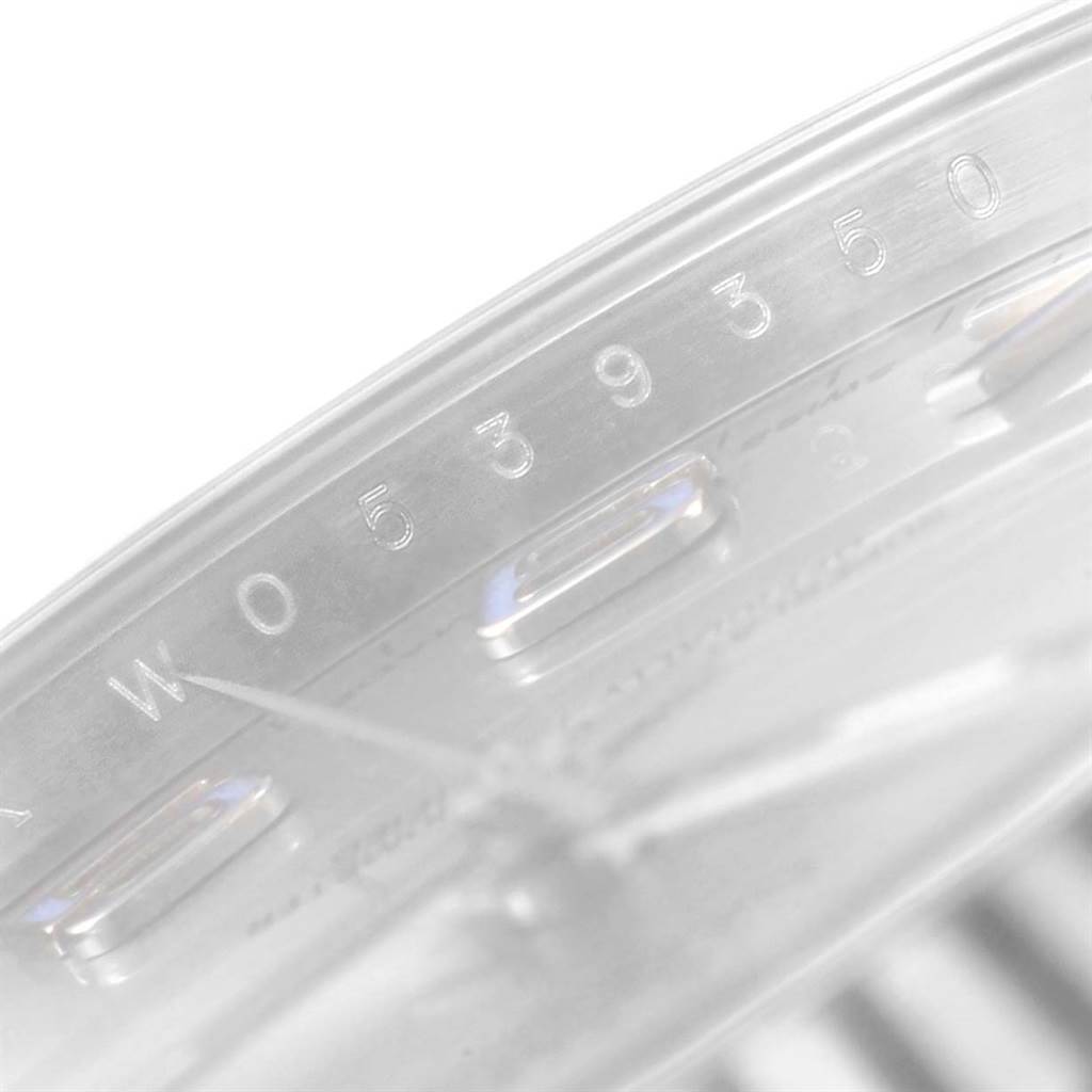 This close-up image of the Datejust 41 model by Rolex shows part of the serial number engraving on the inner bezel.