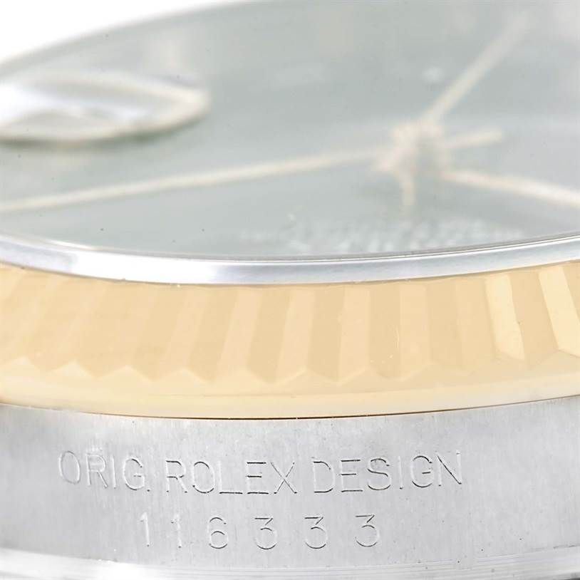 This image shows a close-up of the bezel and case side of a Rolex Datejust 41 116333 Men's Steel and Gold (two tone) Grey Dial 116333 Men's Steel and Gold (two tone) Grey Dial watch, featuring the brand and model engraving.
