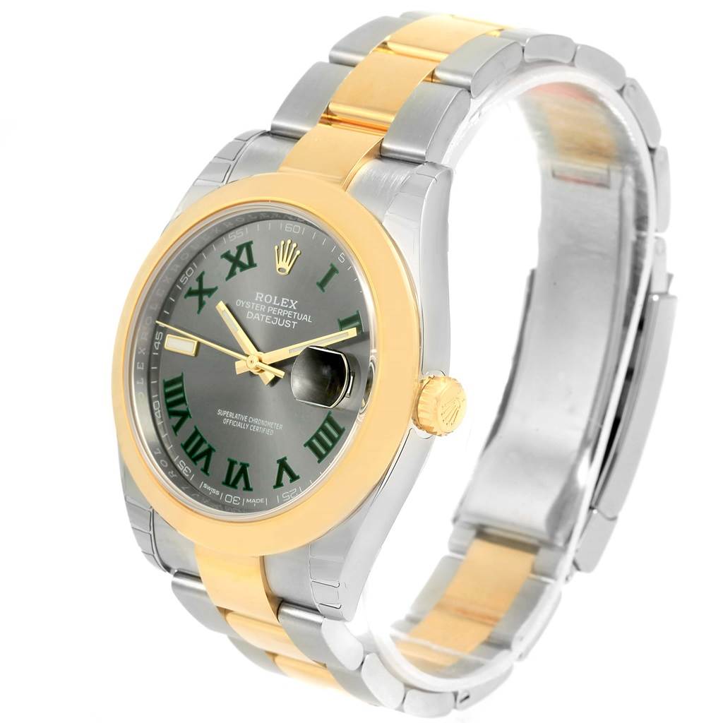 The Rolex Datejust 41 126303 Men's Steel and Gold (two tone) Grey Dial 126303 Men's Steel and Gold (two tone) Grey Dial watch is shown at a three-quarter angle featuring its green dial, gold bezel, and two-tone bracelet.