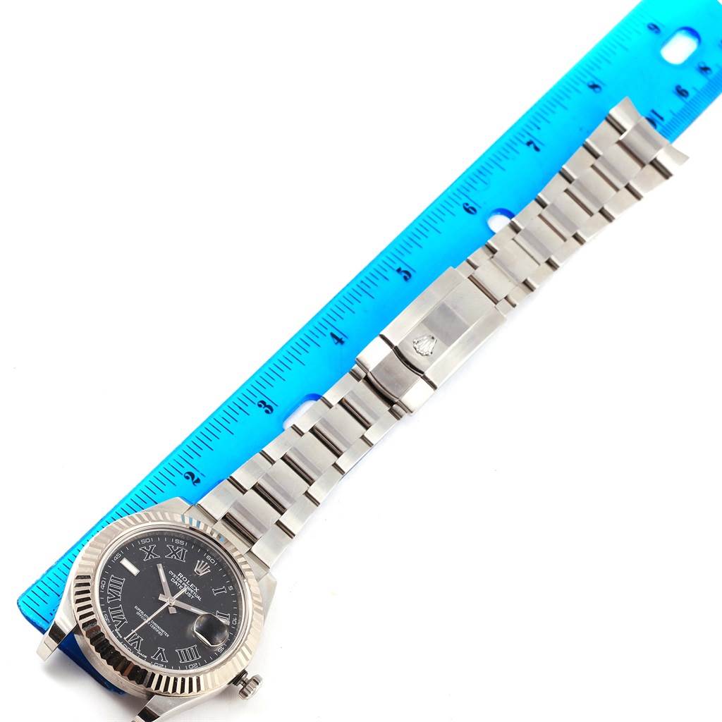 The image shows a Rolex Datejust 41 116334 Men's Stainless Steel Grey Dial 116334 Men's Stainless Steel Grey Dial model watch, including the face, clasp, and band, laid beside a blue ruler for scale.