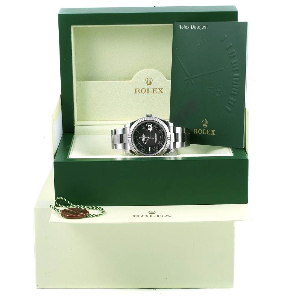 This image shows a Rolex Datejust 41 116334 Men's Stainless Steel Grey Dial 116334 Men's Stainless Steel Grey Dial watch with a black dial in an open green Rolex box, along with the warranty booklet.