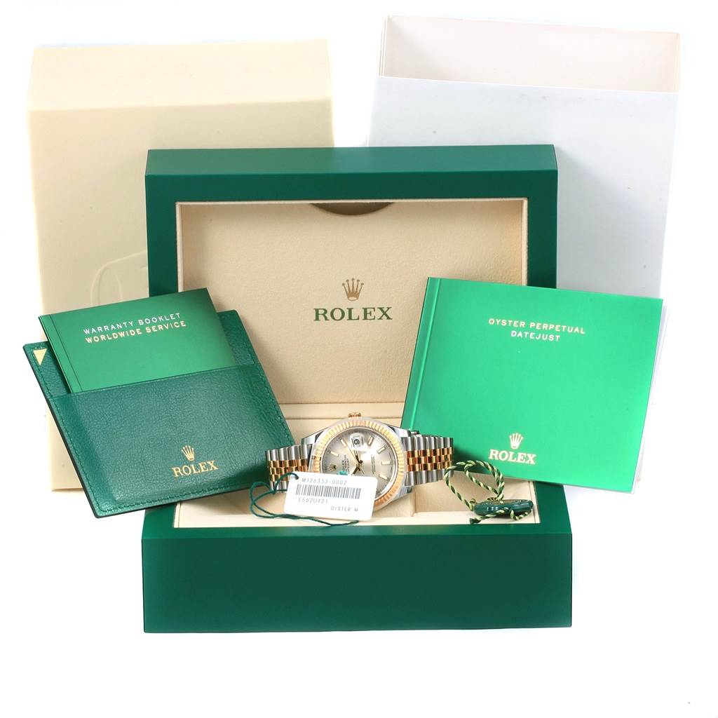 The image shows the Rolex Datejust 41 126333 Men's Steel and Gold (two tone) Silver Dial 126333 Men's Steel and Gold (two tone) Silver Dial watch with its box, warranty booklet, and user manual at eye level.