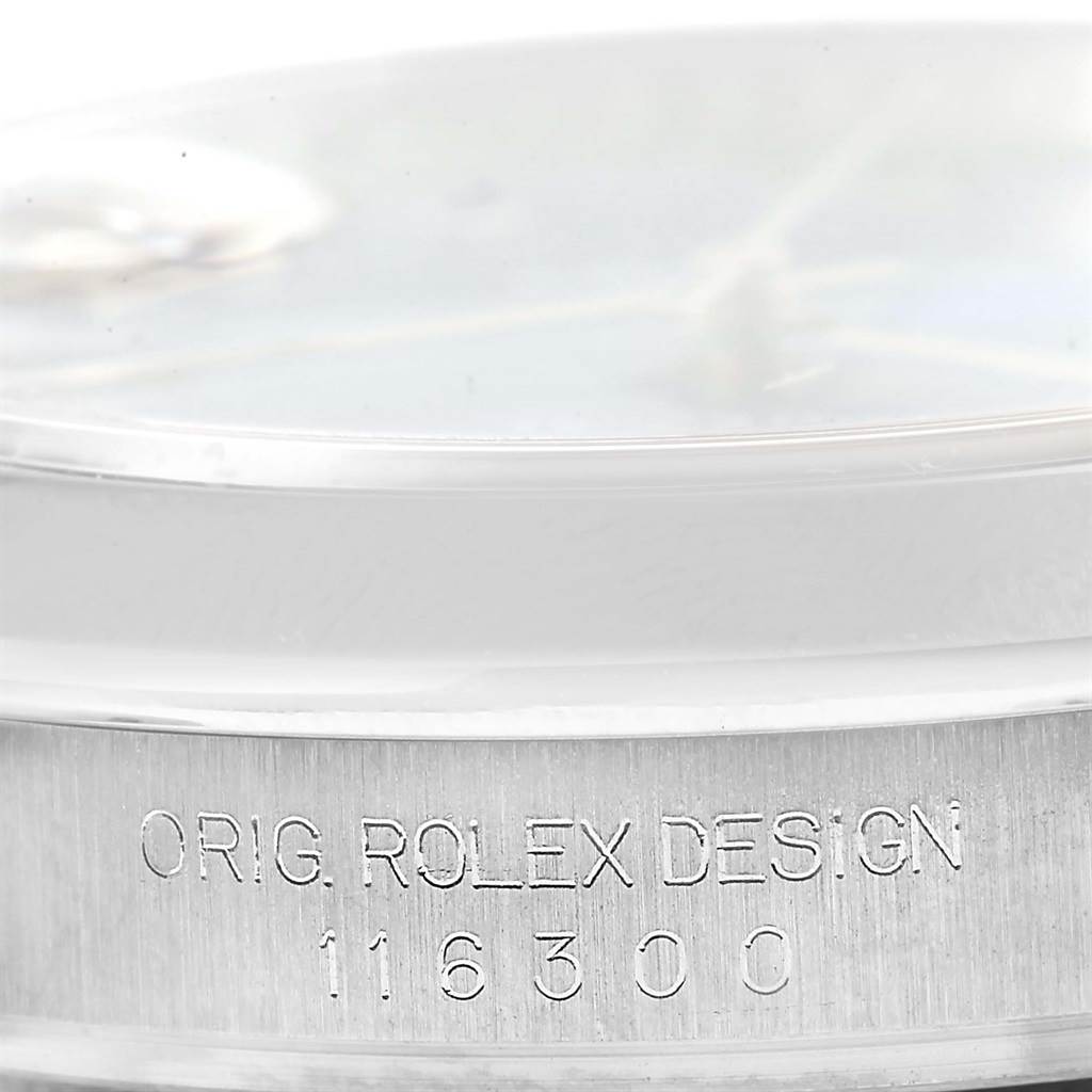 This image shows a close-up of the side of a Rolex Datejust 41 116300 Men
s Stainless Steel Blue Dial 116300 Men
s Stainless Steel Blue Dial model with the engraving "ORIG. ROLEX DESIGN 116300" visible.
