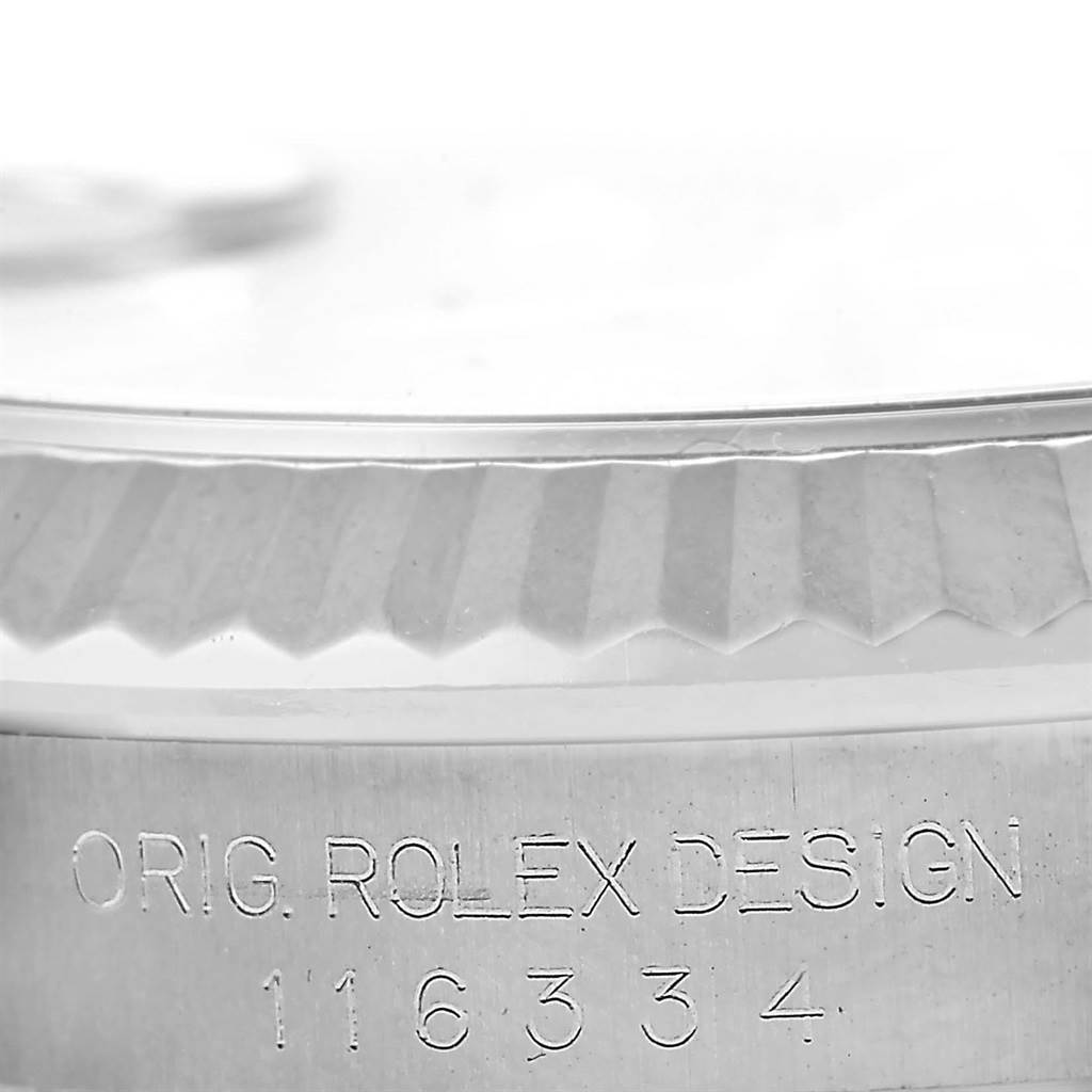 This image shows a close-up of the case side with engraved text on the Rolex Datejust 41 116334 Men's Stainless Steel Grey Dial 116334 Men's Stainless Steel Grey Dial watch.
