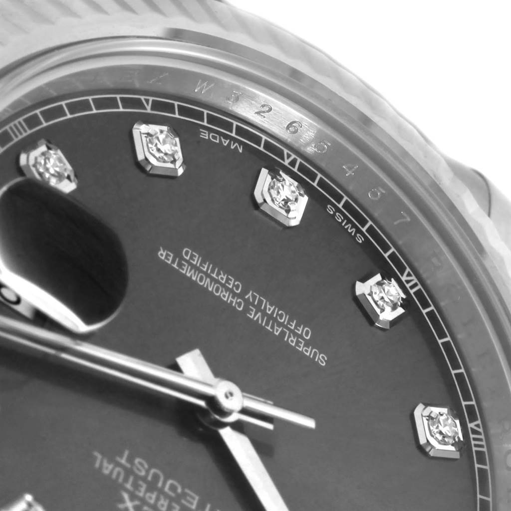 The image shows a close-up angle of the Rolex Datejust 41 116334 Men's Stainless Steel Grey Dial 116334 Men's Stainless Steel Grey Dial, highlighting part of the dial with diamond hour markers and the date magnification window.