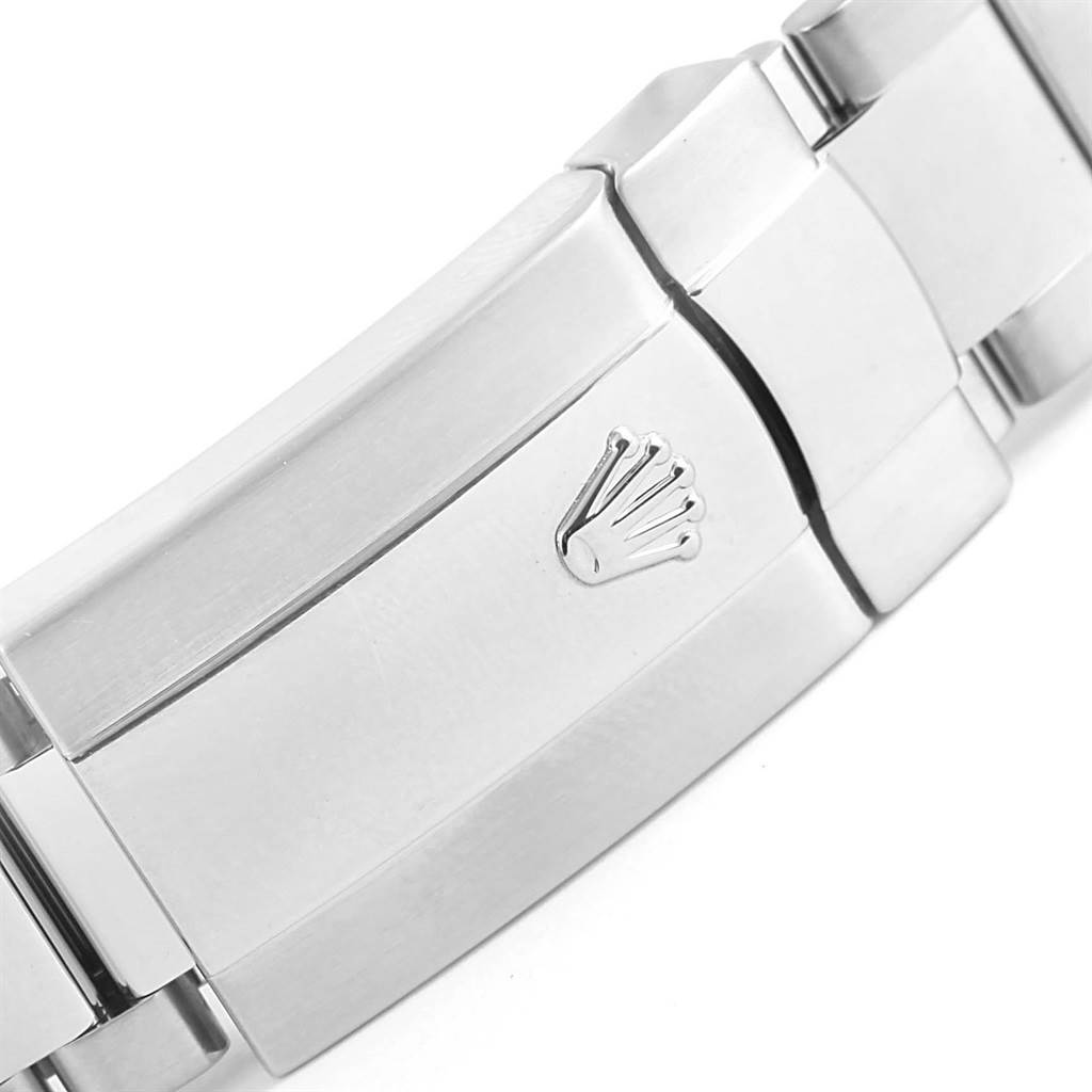 The image shows a close-up of the clasp mechanism with the Rolex logo on a Datejust 41 model by Rolex.