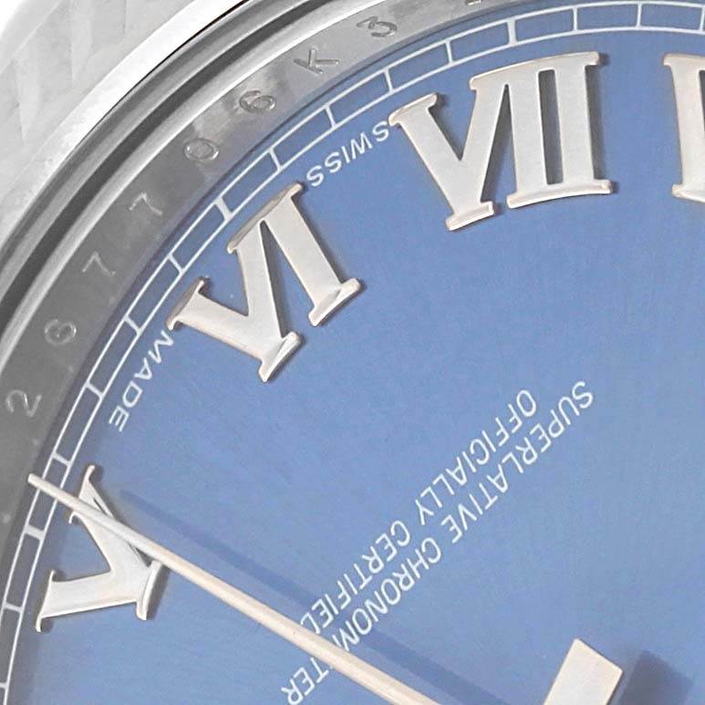 This image shows a close-up of the dial and minute hand of a Rolex Datejust 41 116334 Men's Stainless Steel Blue Dial 116334 Men's Stainless Steel Blue Dial, highlighting the Roman numerals and text details.