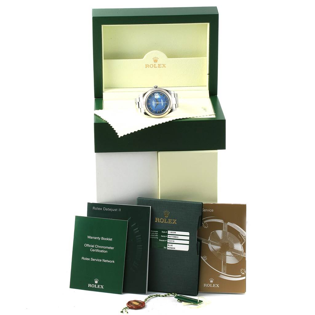 The image shows a Rolex Datejust 41 116334 Men's Stainless Steel Blue Dial 116334 Men's Stainless Steel Blue Dial watch in its box, accompanied by booklets and tags.