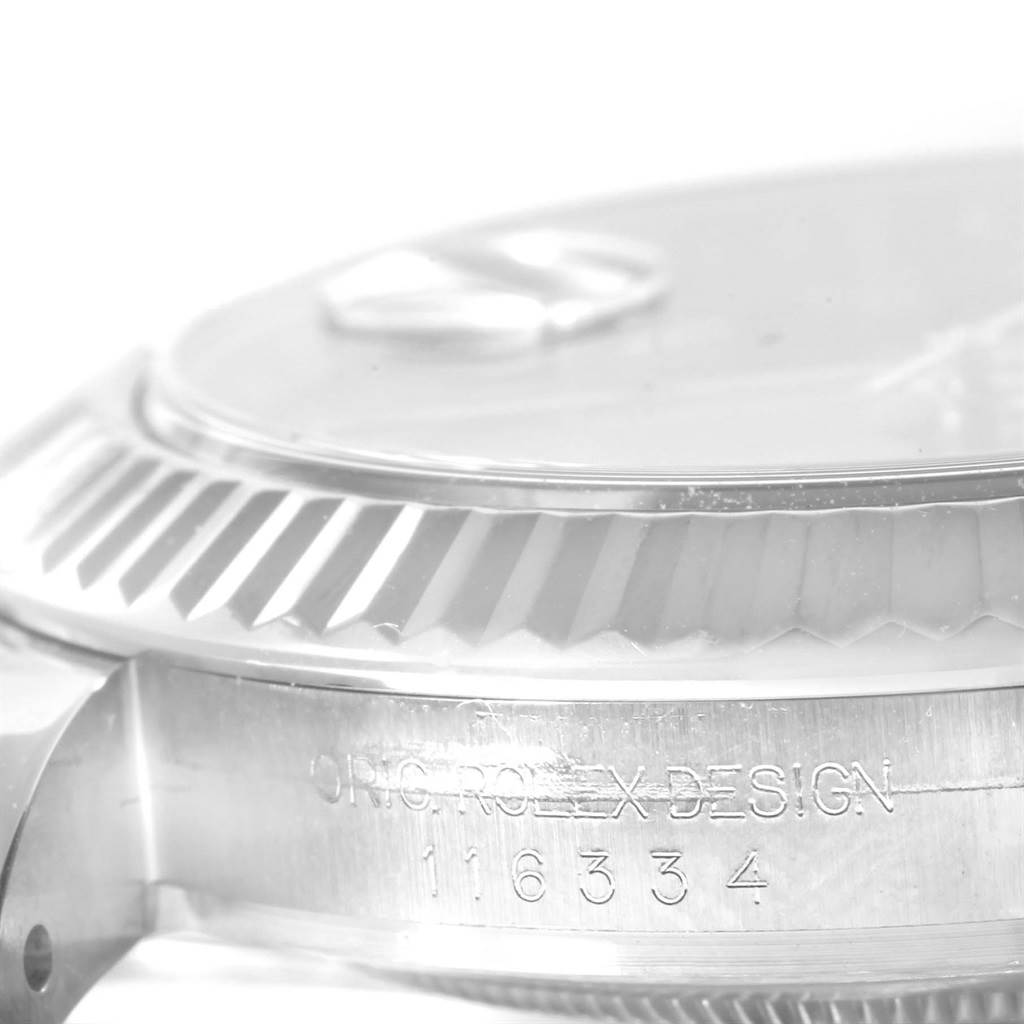 The image shows a close-up side view of the Rolex Datejust 41 116334 Men's Stainless Steel Blue Dial 116334 Men's Stainless Steel Blue Dial watch, highlighting its bezel and part of the case with model number engravings.