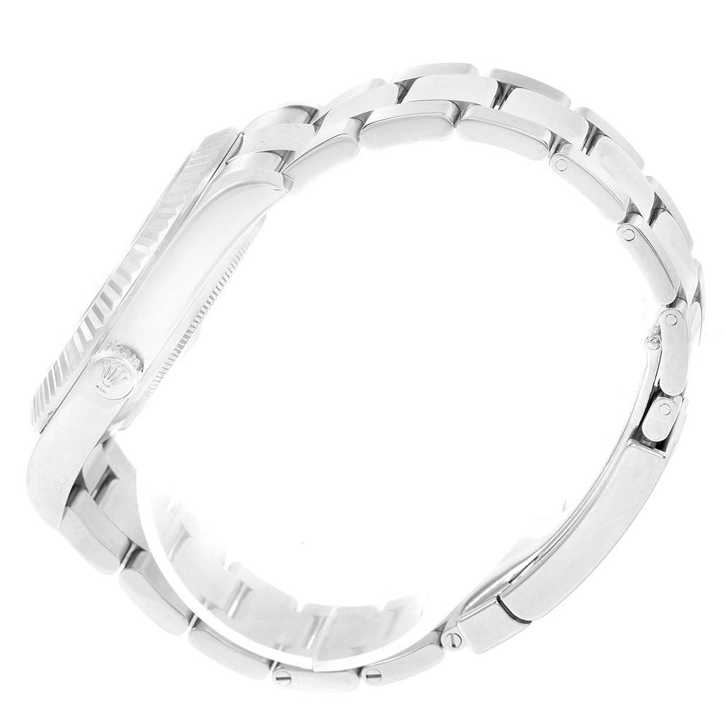 The image shows a side view of a Rolex Datejust 41 116334 Men's Stainless Steel Blue Dial 116334 Men's Stainless Steel Blue Dial, highlighting its case, fluted bezel, crown, and part of the bracelet.