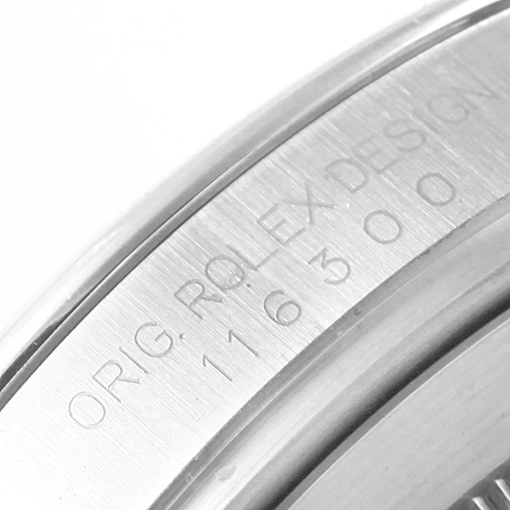 The close-up image shows the engraved side of the bezel of a Rolex Datejust 41 116300 Men
s Stainless Steel White Dial 116300 Men
s Stainless Steel White Dial watch. 